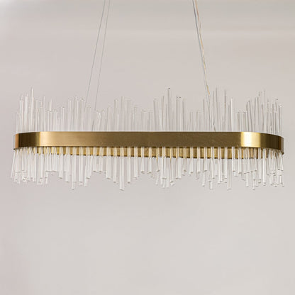 Gold metal chandelier with vertical glass rods displayed with lights off on a white background showing its sleek contemporary structure.