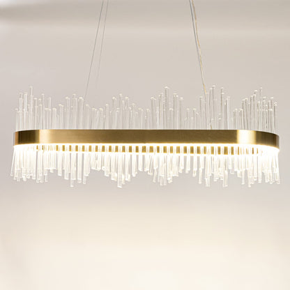 Gold metal chandelier with clear glass rods shown with lights on against a white background highlighting its bright elegant illumination.