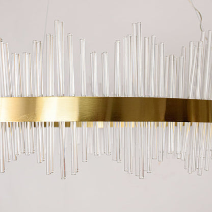 Closeup of gold metal chandelier band with clear glass rods showing refined craftsmanship and premium luxury lighting detail.