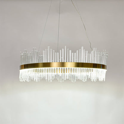 Contemporary gold metal chandelier with bright glass rods offering elegant ceiling lighting for living room interiors.