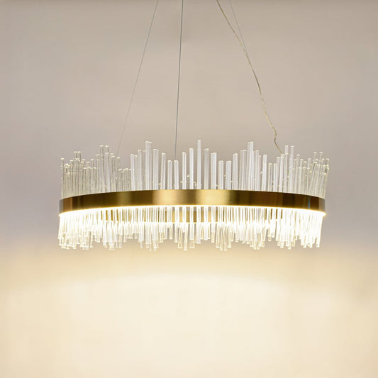 Designer gold metal chandelier glowing with clear glass rods perfect for modern dining spaces and upscale interior decor.