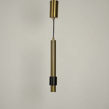 Contemporary gold pendant hanging light turned on with black detailing displayed on white background for interiors.