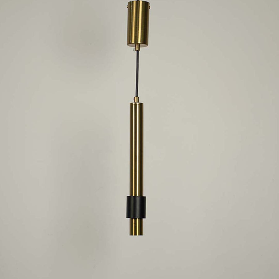 Contemporary gold pendant hanging light turned on with black detailing displayed on white background for interiors.