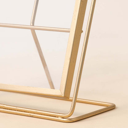 Closeup of gold metal photo frame base showcasing premium craftsmanship and elegant contemporary decorative styling.