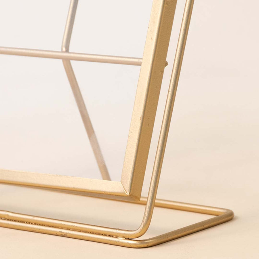 Closeup of gold metal photo frame base showcasing premium craftsmanship and elegant contemporary decorative styling.
