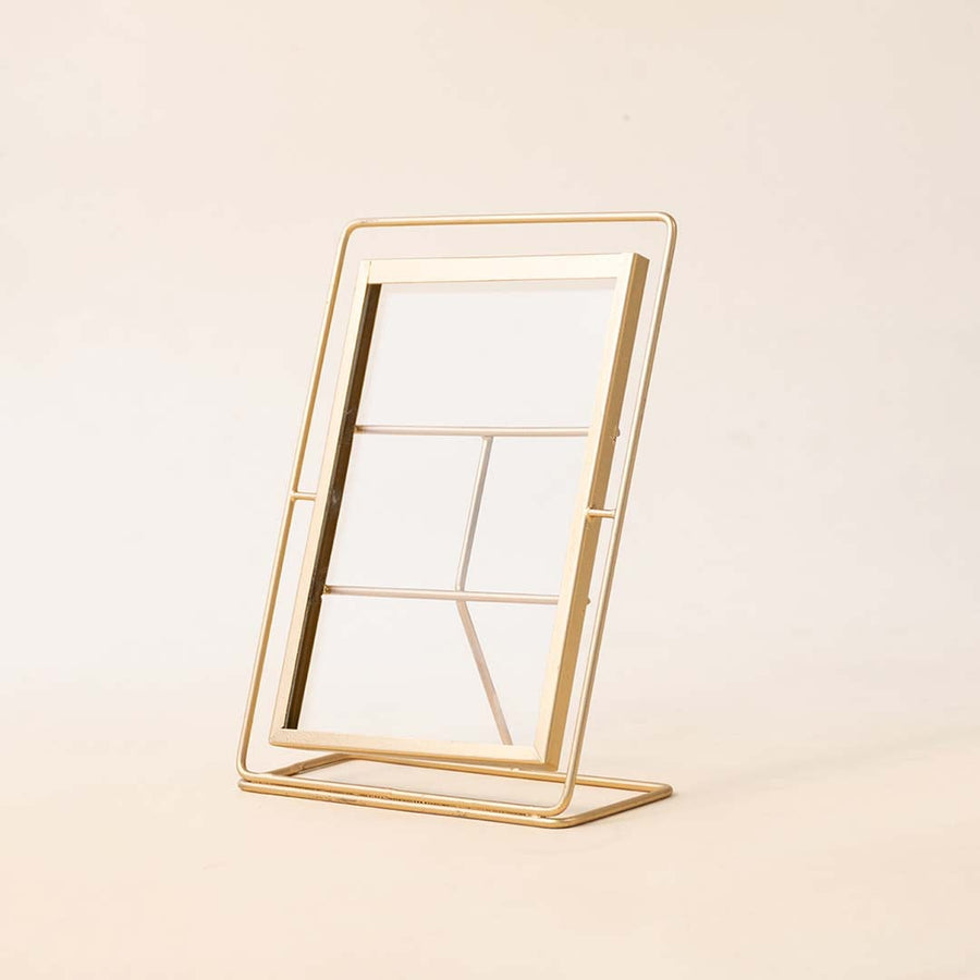 Gold metal photo frame with minimalist geometric design for tabletop styling and modern home decor displays.
