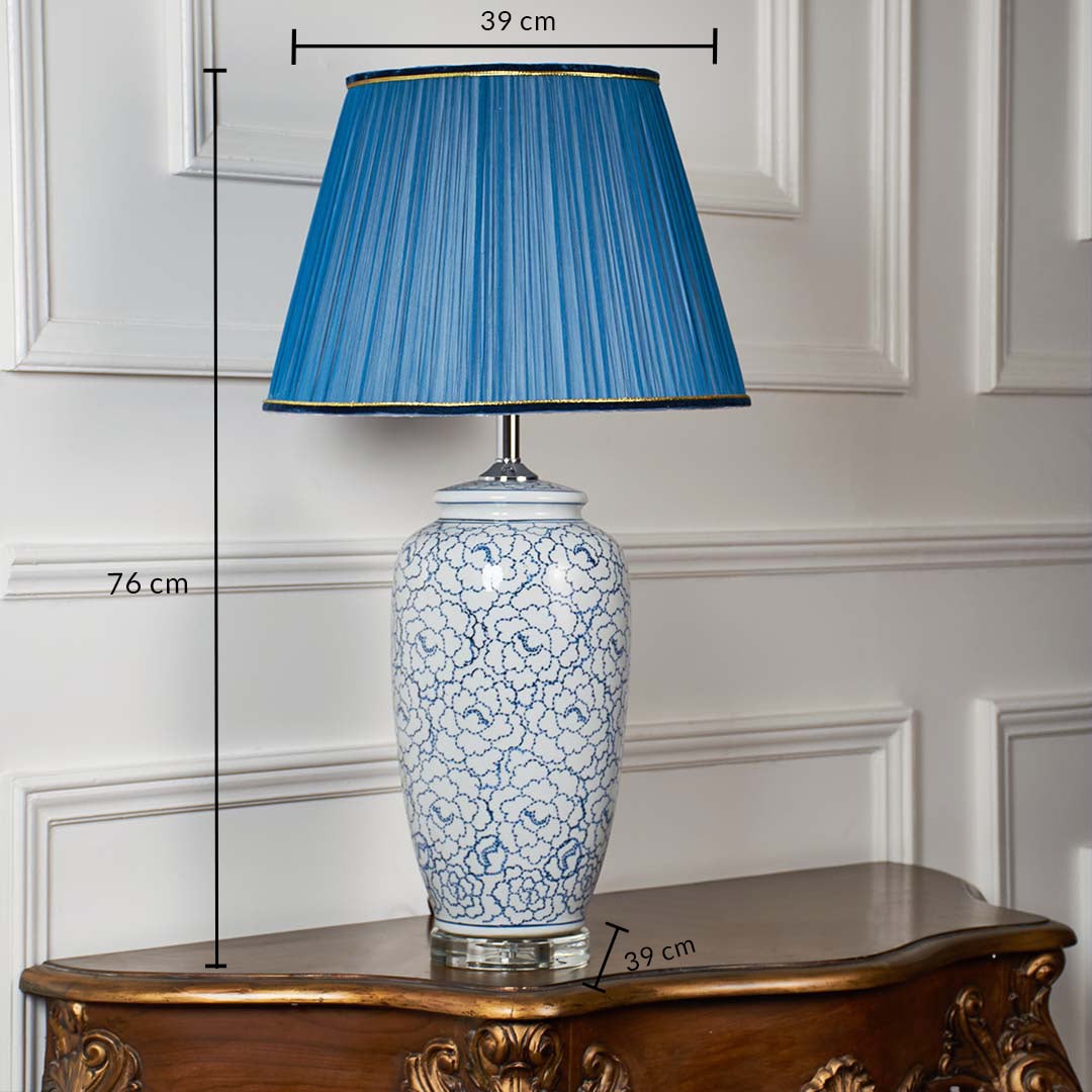 Blue floral ceramic table lamp with blue pleated shade measuring 76 cm height and 39 cm width with base width also 39 cm shown clearly with dimension markings.