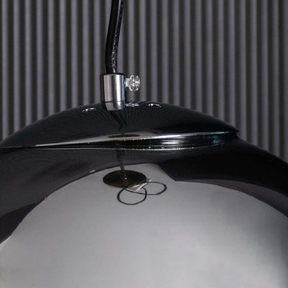 A detailed close view showing the smoked glass globe and warm glow creating a stylish modern lighting accent for contemporary spaces.
