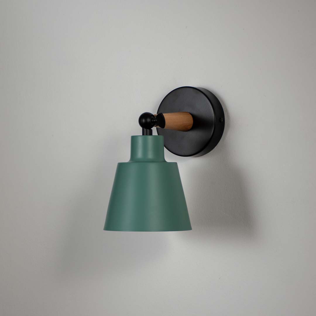 Modern wooden wall sconce with green conical lampshade light off white background for bedroom hallway and study stylish wall lighting decor.