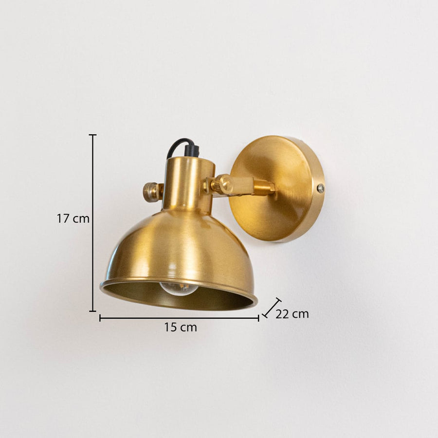 Gold metal wall light measuring 17 cm height 15 cm shade width and 22 cm projection suitable for indoor wall mounting.