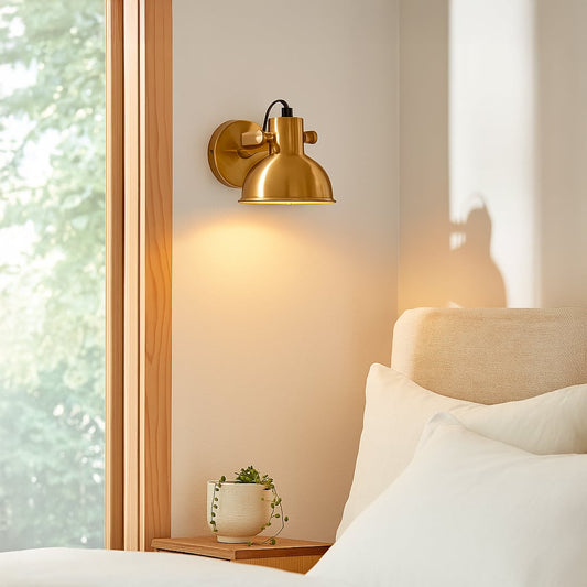 Gold metal wall light mounted beside sofa creating warm focused lighting ideal for reading corners and elegant living room Decor.