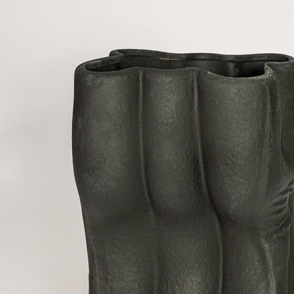 Black ceramic decorative floor vase with artistic textured surface perfect for dried floral display and contemporary interior decor styling.