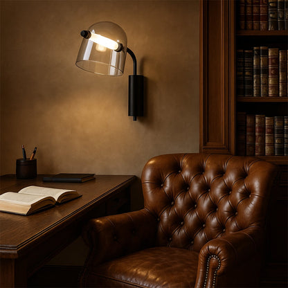 Modern wall light installed above a study desk in a classic library setting casting warm focused light over a leather chair wooden table and books for an elegant reading atmosphere.