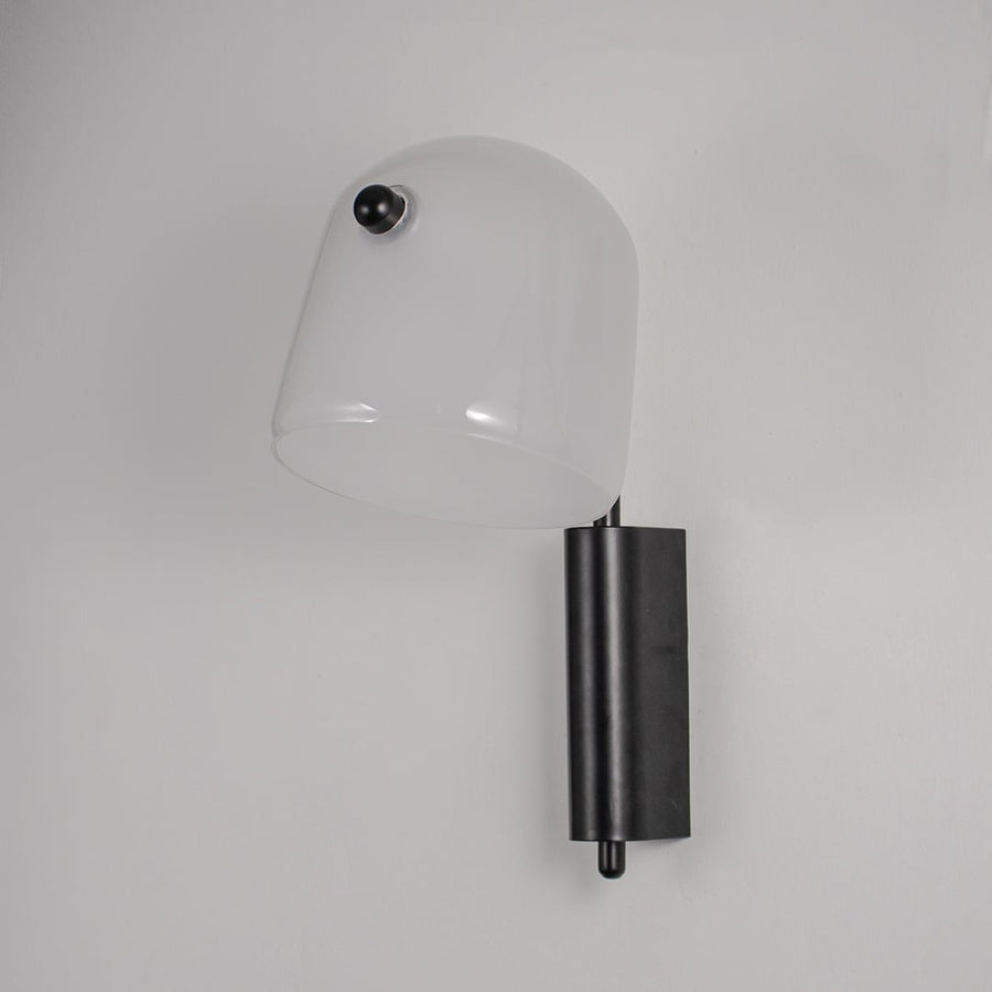 Frosted white glass wall light with black metal base light off on white background modern wall lighting for bedroom decor.