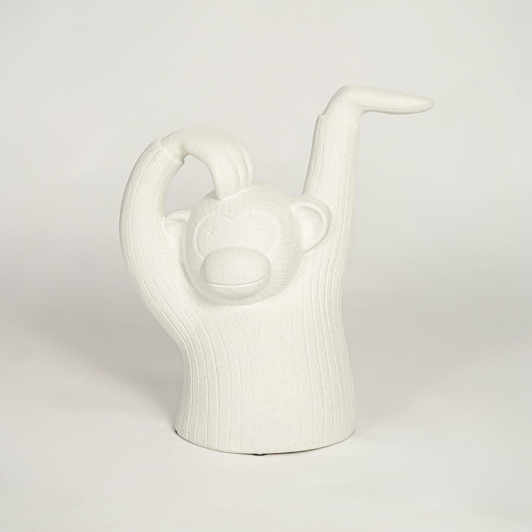 Modern white monkey figurine decor on white background textured sculptural accent for shelf console or office styling.