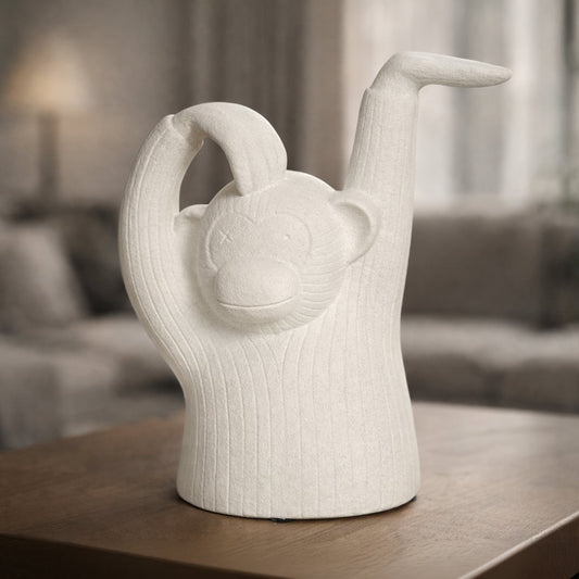 White textured monkey sculpture decor with raised arms playful artistic figurine styled for console table shelf or modern living room decor.
