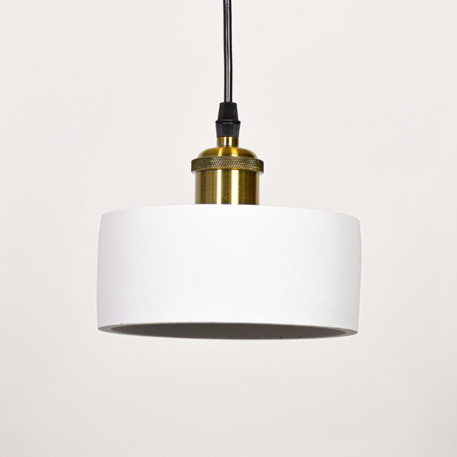 Minimal white metal pendant light with gold holder switched off on white background for modern ceiling decor styling.