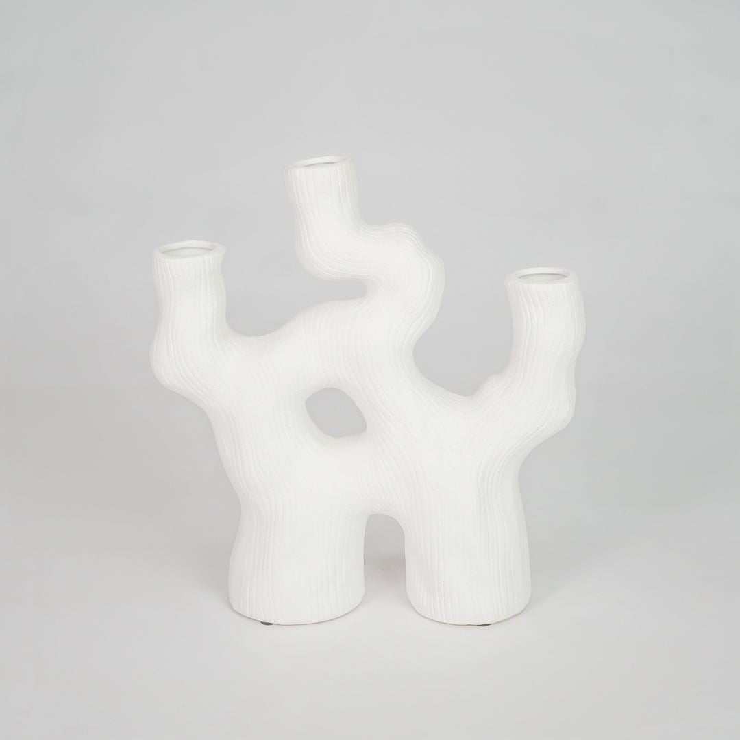 Closeup image of white ceramic abstract decor vase for modern tabletop styling with smooth matte finish.