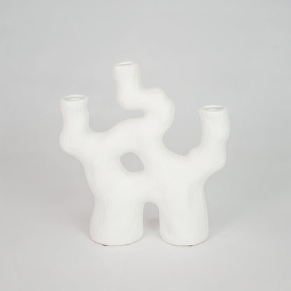 Closeup image of white ceramic abstract decor vase for modern tabletop styling with smooth matte finish.
