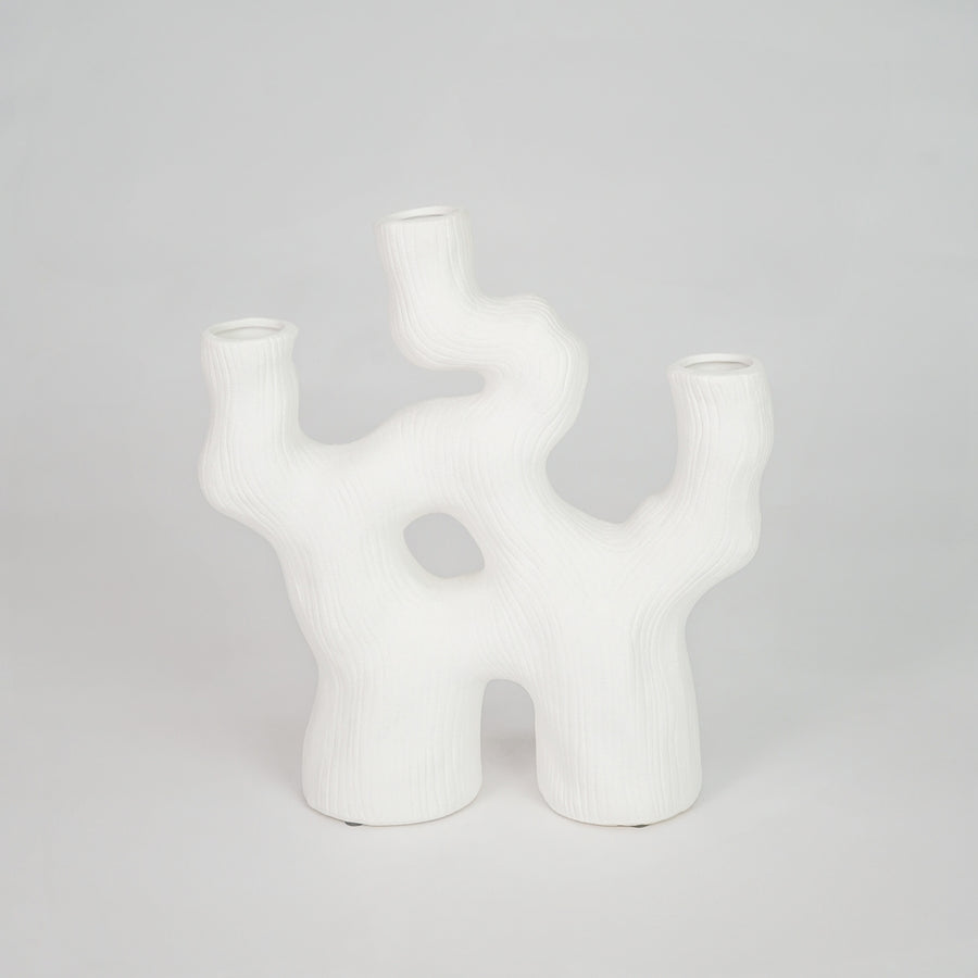 Closeup image of white ceramic abstract decor vase for modern tabletop styling with smooth matte finish.
