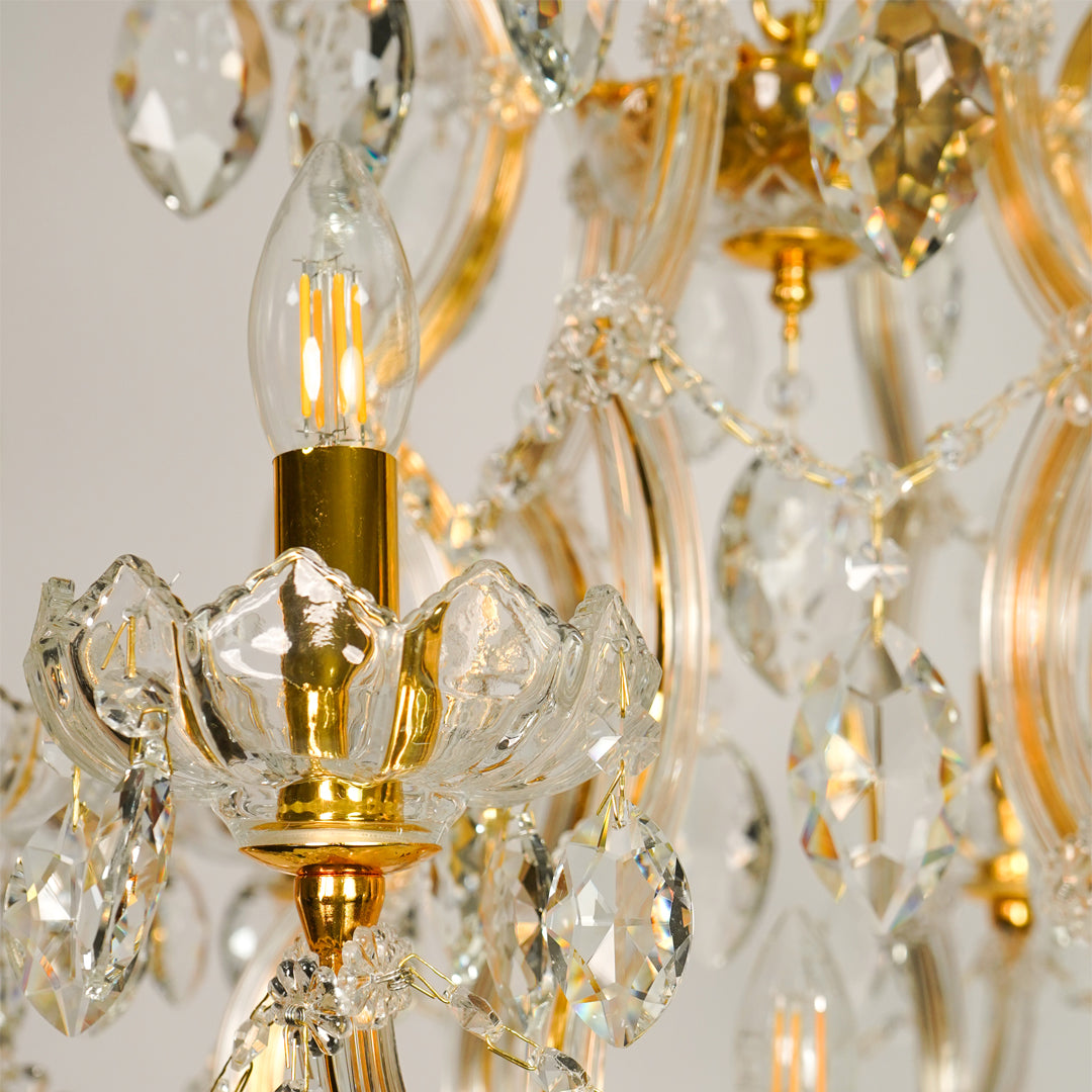 Closeup image of elegant clear crystal chandelier for luxury living room decor styling with elegant polished metal finish.