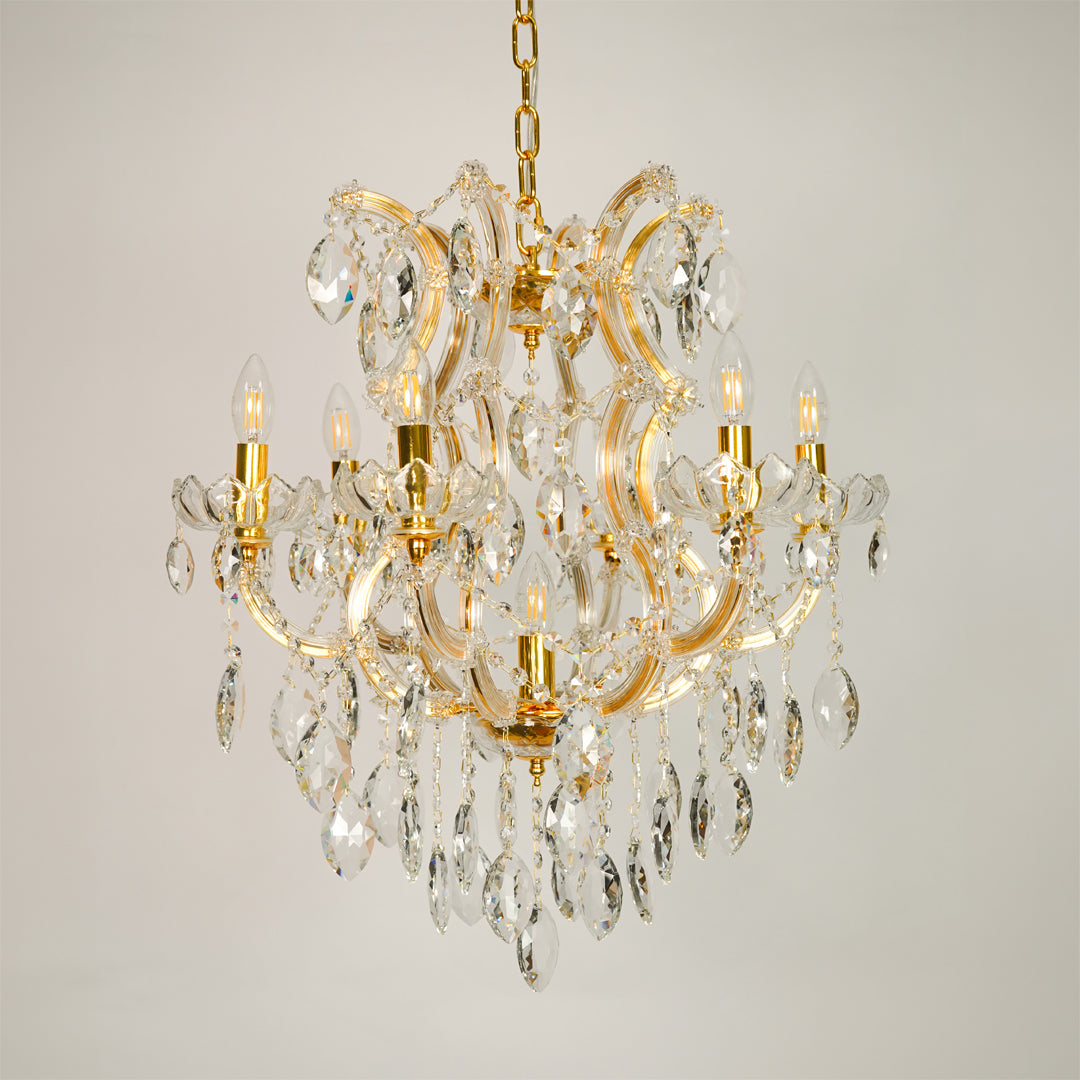 White background image of elegant clear crystal chandelier for elegant dining room decor styling with unlit crystal arms.