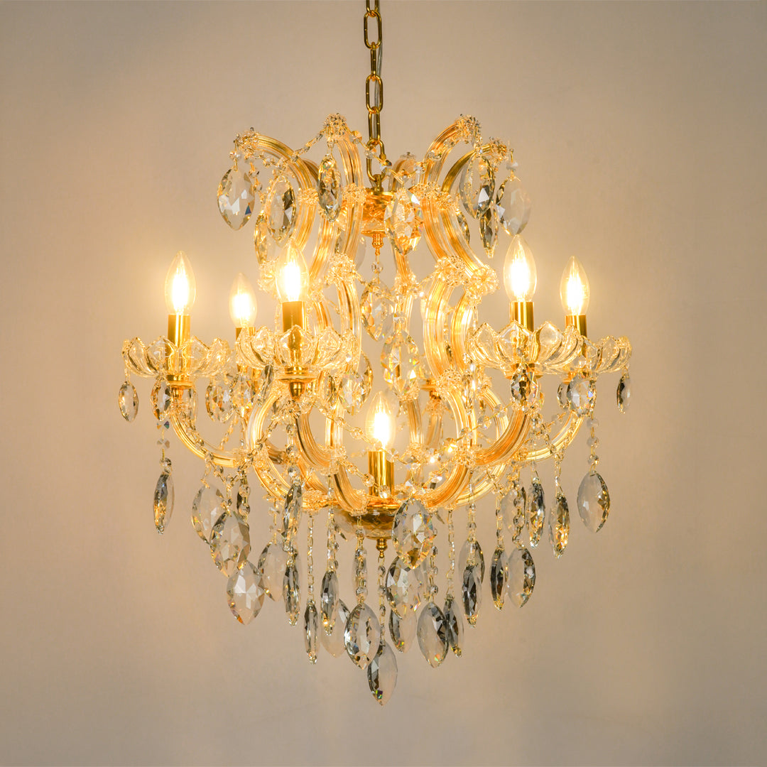 White background image of elegant clear crystal chandelier for modern living room decor styling with bright warm lighting.