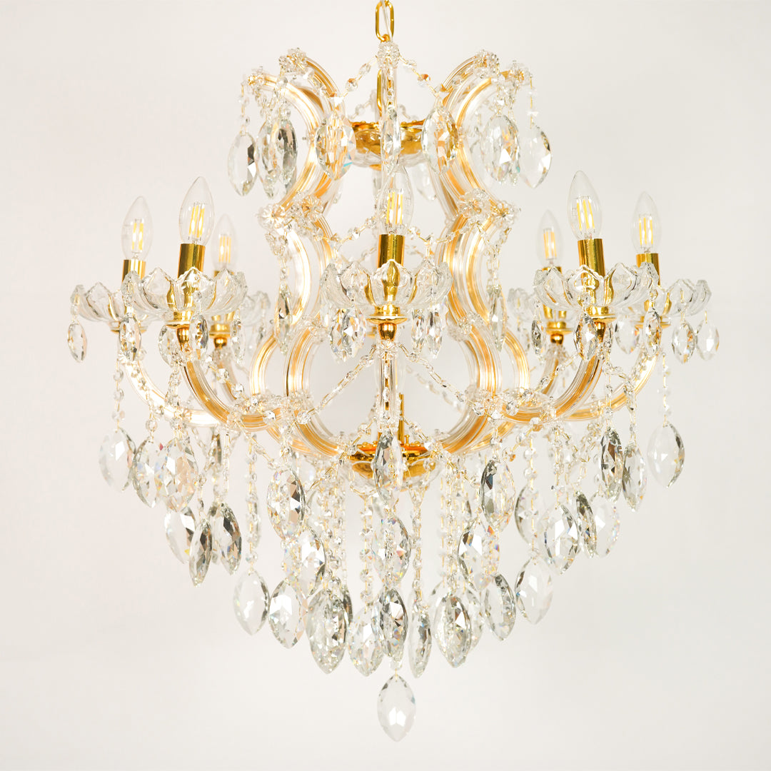 White background image of large clear crystal chandelier for elegant dining room decor styling with unlit clear crystals.
