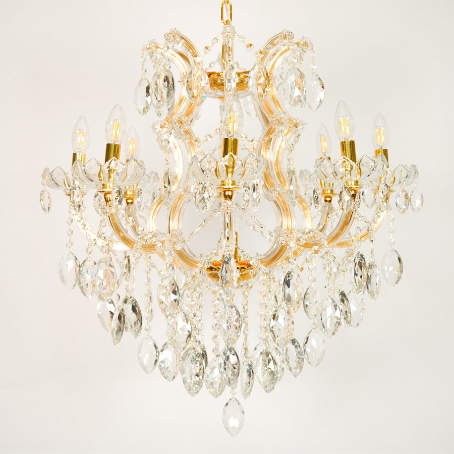 White background image of large clear crystal chandelier for elegant dining room decor styling with unlit clear crystals.