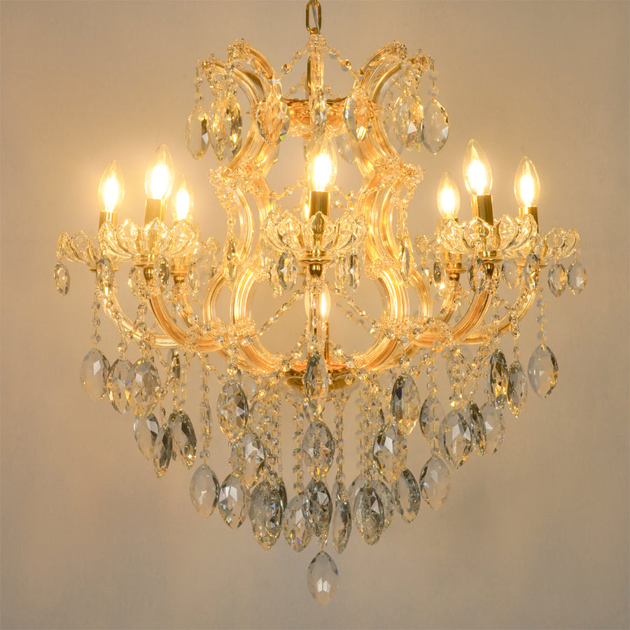 White background image of large clear crystal chandelier for modern living room decor styling with a bright warm lighting.