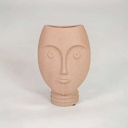 Pink textured face ceramic vase for stylish console table placement and contemporary indoor decor styling.