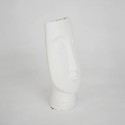 White sculptural ceramic vase for modern shelf placement and elegant indoor home decor styling accent piece.
