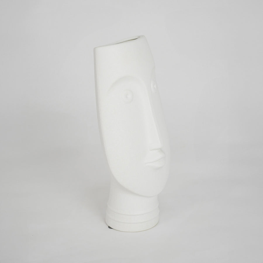 White sculptural ceramic vase for modern shelf placement and elegant indoor home decor styling accent piece.