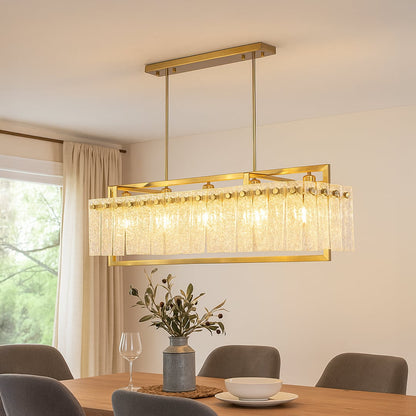 Gold crystal chandelier with cascading glass accents illuminating elegant dining room creating luxurious modern interior.
