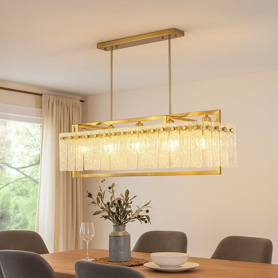Gold crystal chandelier with cascading glass accents illuminating elegant dining room creating luxurious modern interior.