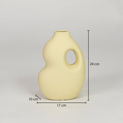 Yellow ceramic decorative vase size 24 cm height 17 cm width 10 cm depth modern designer vase for table console styling.