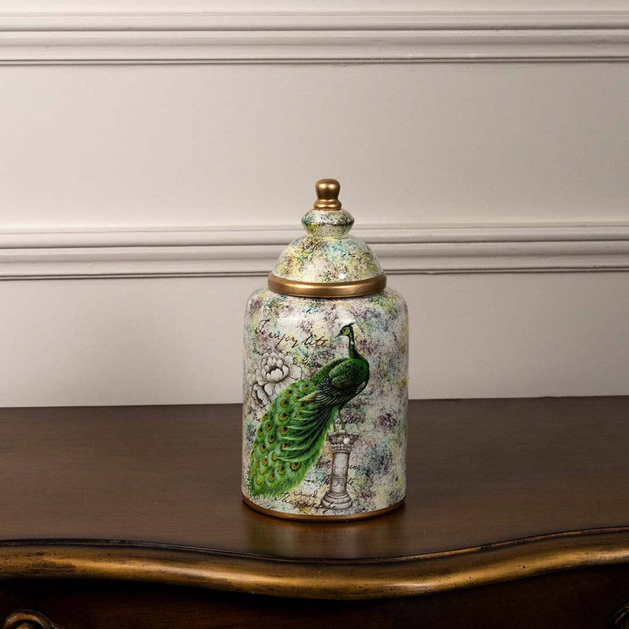 Decorative ceramic jar with hand painted green bird motif displayed on white background adding artistic charm to tabletop Decor styling.