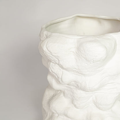 White ceramic decorative vase with detailed organic textured surface perfect for dried floral display and elegant interior decor styling.