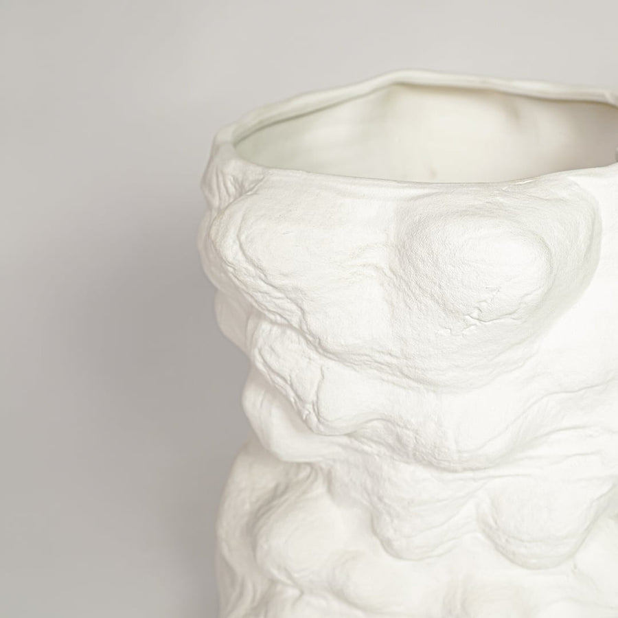 White ceramic decorative vase with detailed organic textured surface perfect for dried floral display and elegant interior decor styling.