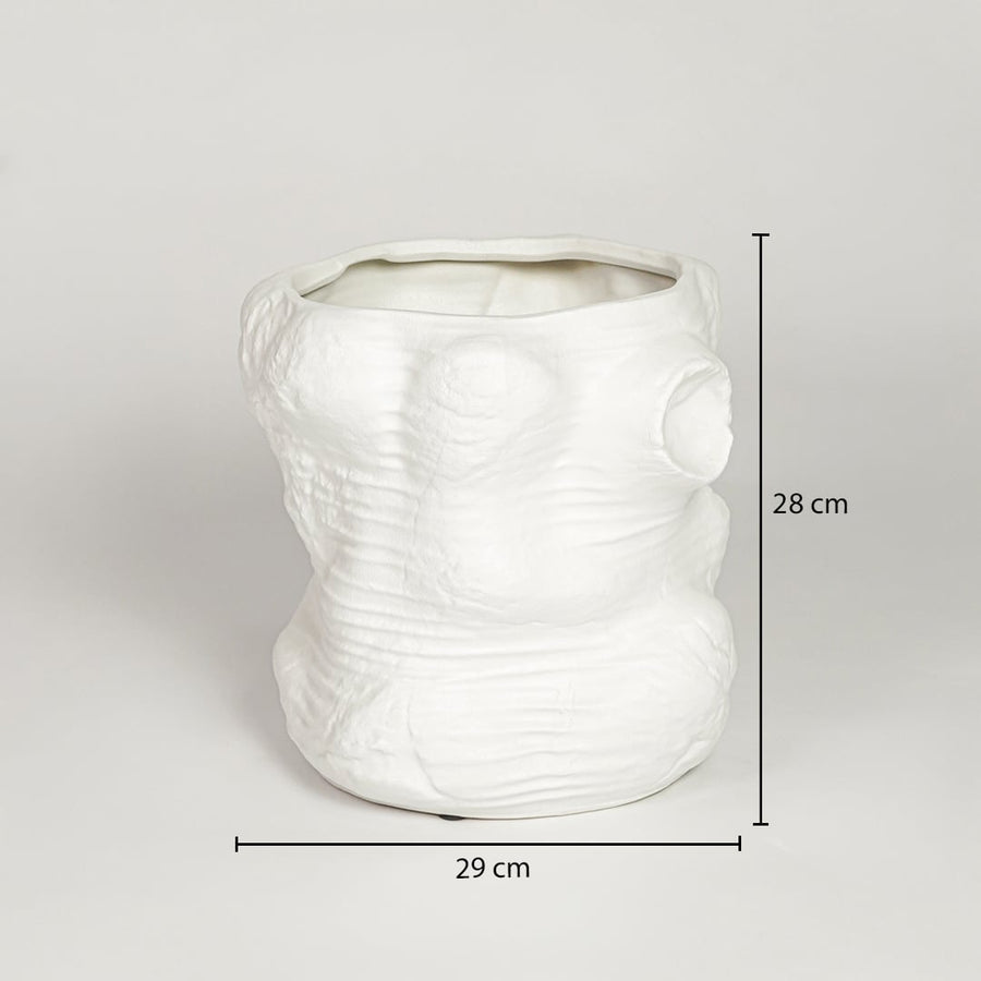 White ceramic sculpted decorative vase measuring 28 cm height and 29 cm width ideal for modern home decor placement.