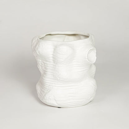Matte white ceramic face vase with artistic textured design perfect for contemporary home decor shelf table or entryway display.