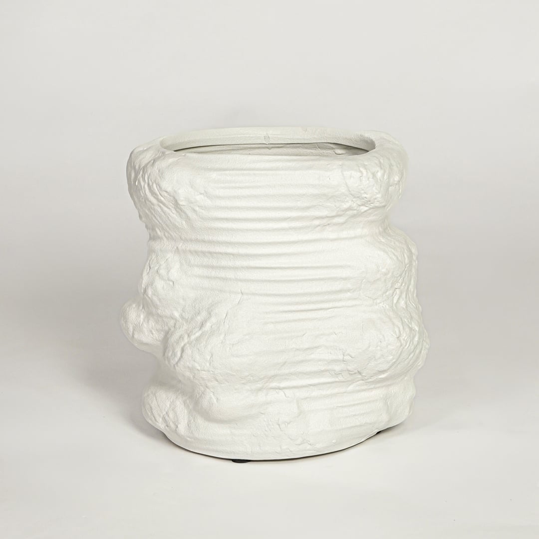 White ceramic planter on white background textured modern decorative plant pot for living room floor styling home.