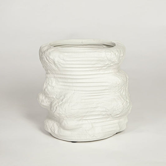 White ceramic planter on white background textured modern decorative plant pot for living room floor styling home.
