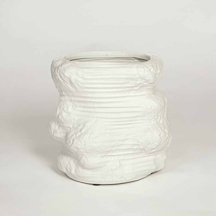 White ceramic planter on white background textured modern decorative plant pot for living room floor styling home.