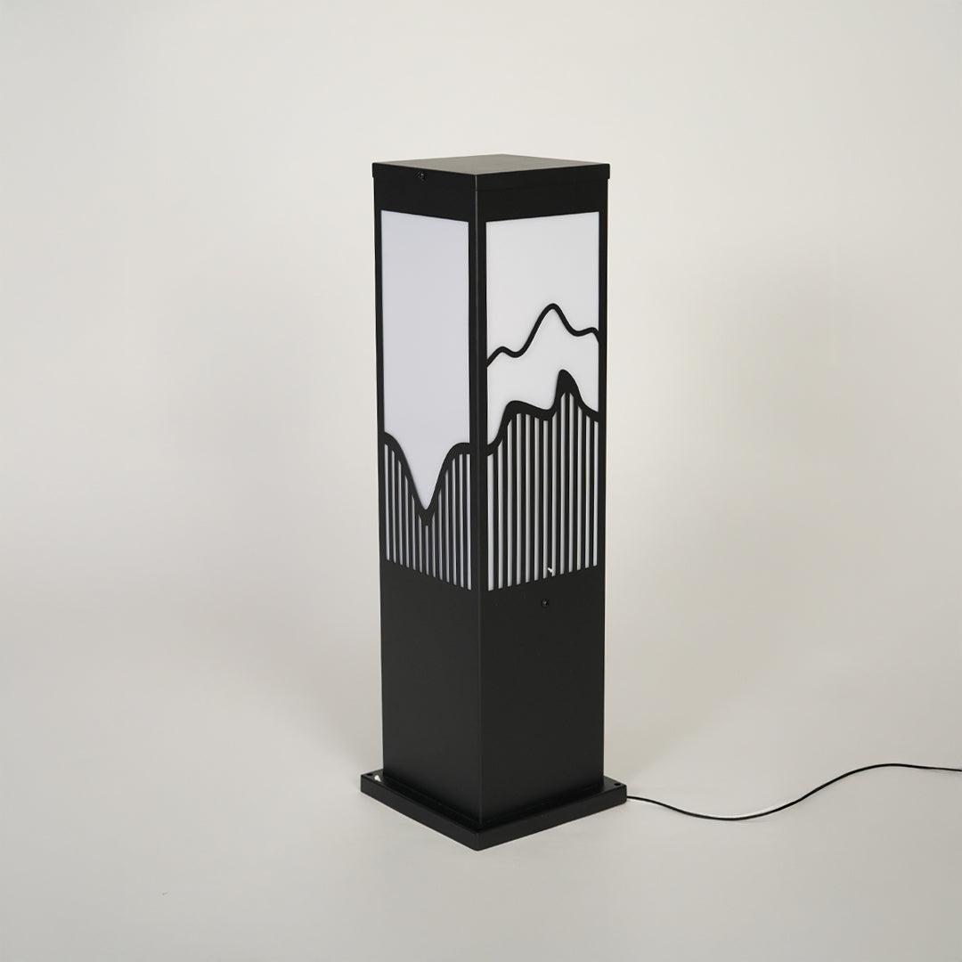 Minimal outdoor bollard light with black metal body and decorative glass pattern on neutral background ideal for exterior lighting setup.