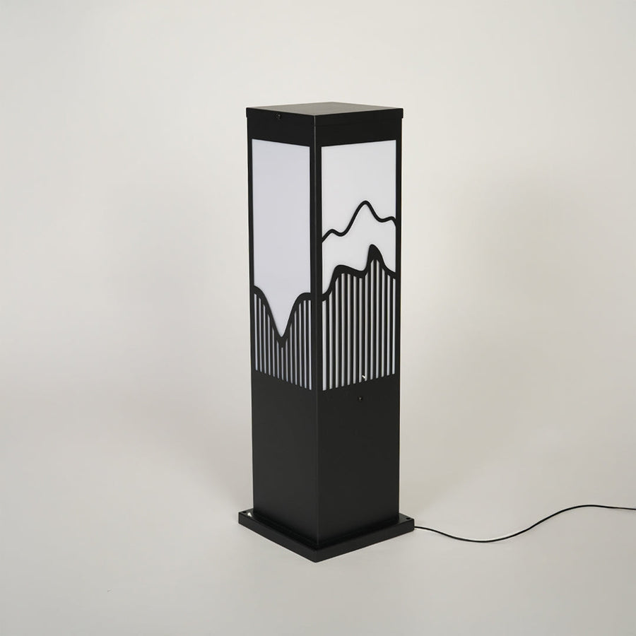 Minimal outdoor bollard light with black metal body and decorative glass pattern on neutral background ideal for exterior lighting setup.