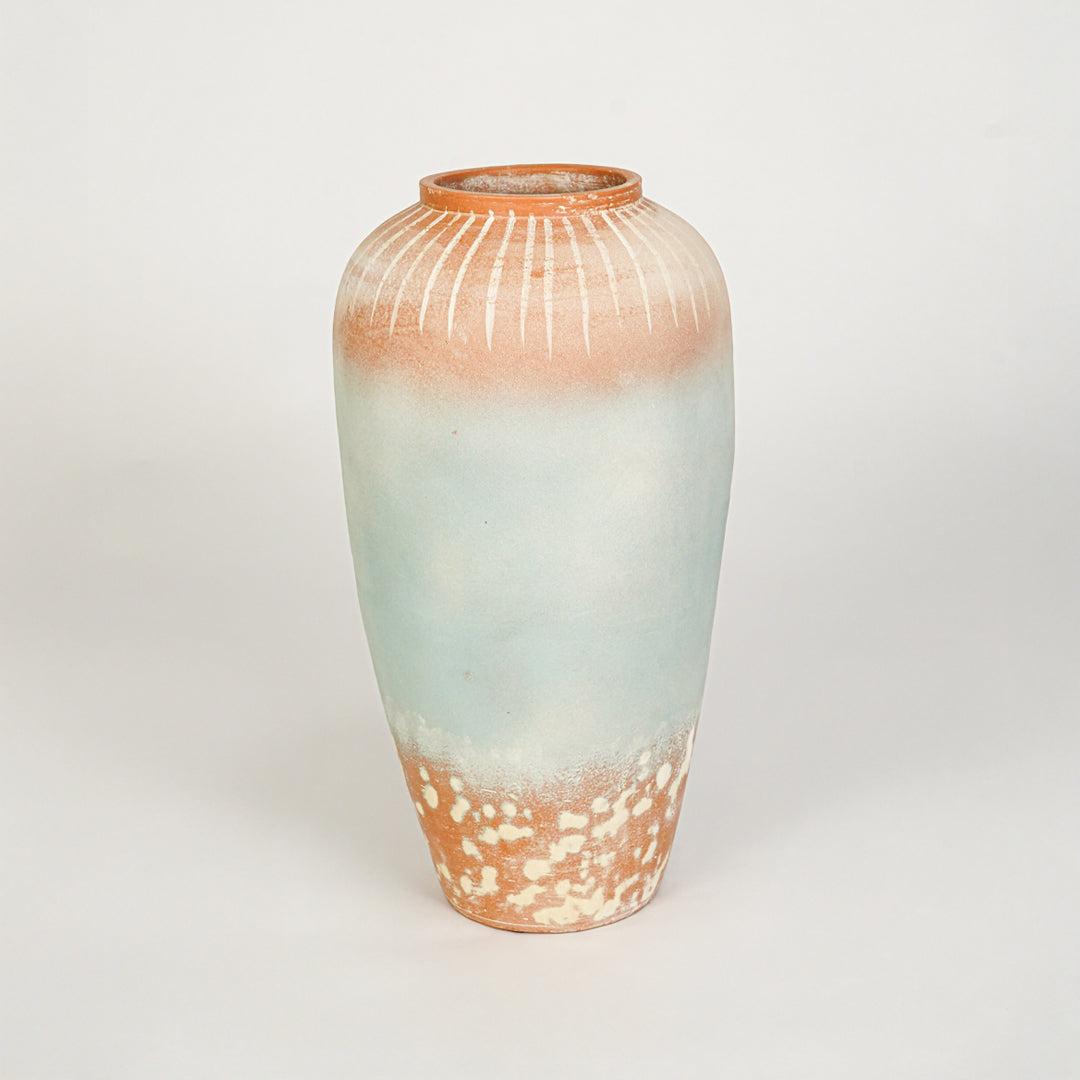 White background image of blue ceramic decorative vase for modern floor placement with textured matte finish.