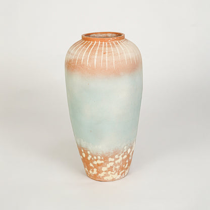White background image of blue ceramic decorative vase for modern floor placement with textured matte finish.