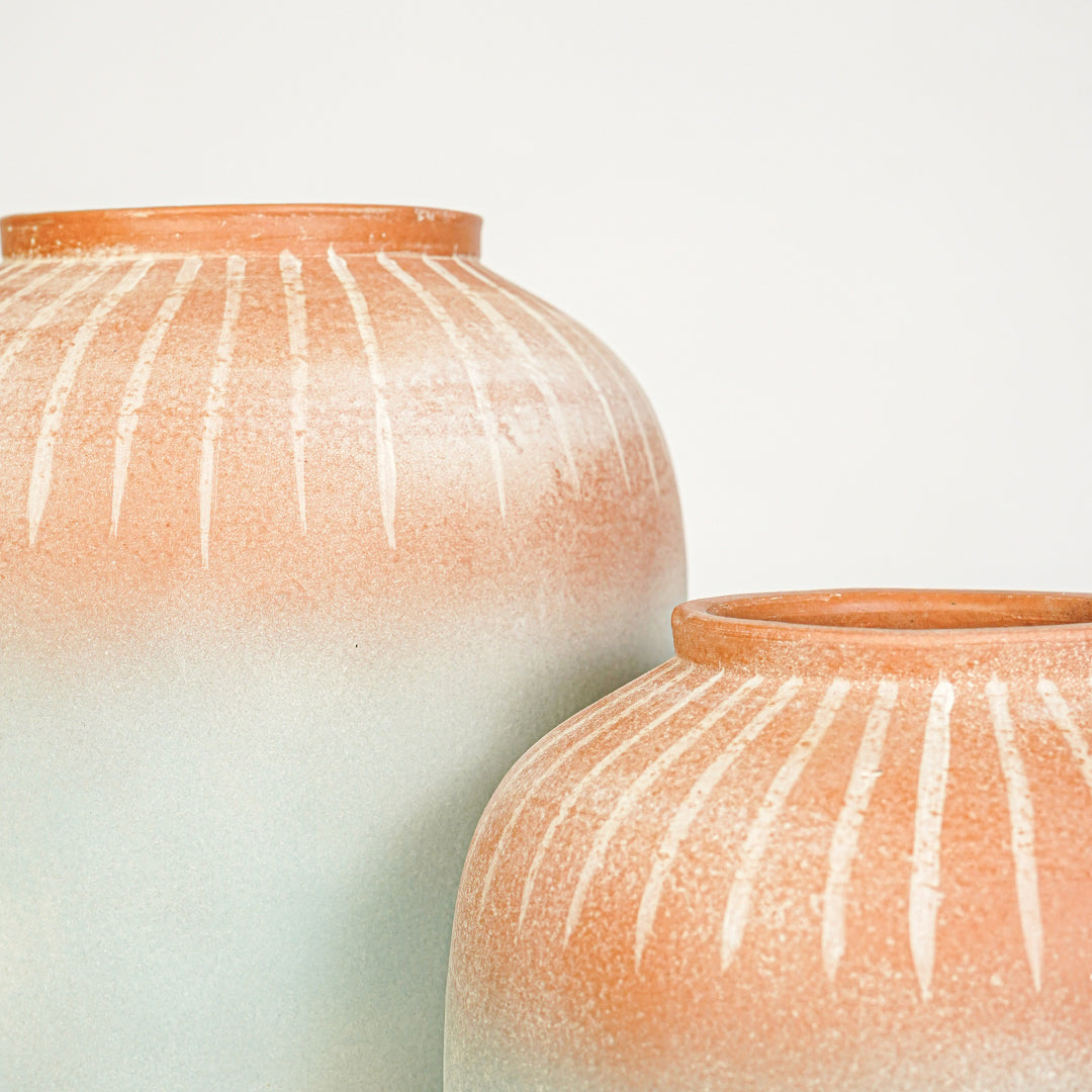 Closeup image of blue and terracotta ceramic vase set for modern interior decor styling with artistic finish.