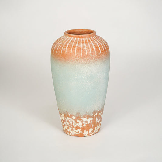 White background image of blue terracotta ceramic vase for elegant floor decor styling with artistic finish.